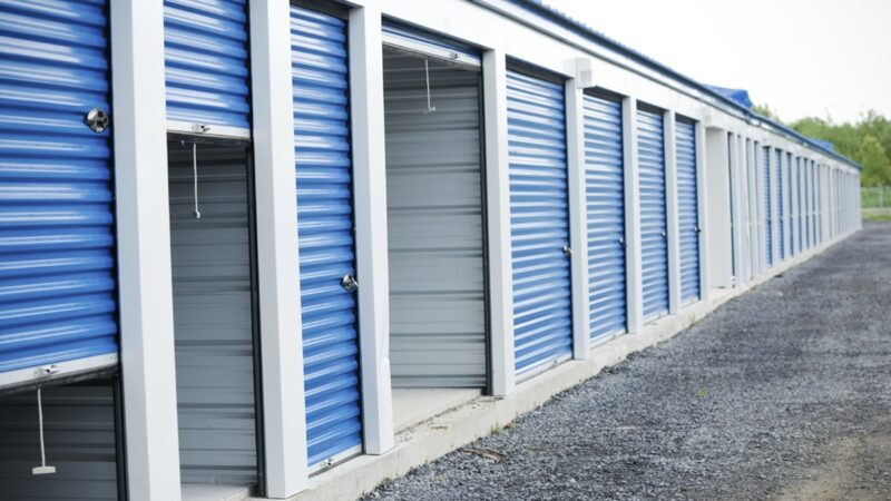 Self storage units with blue garage doors