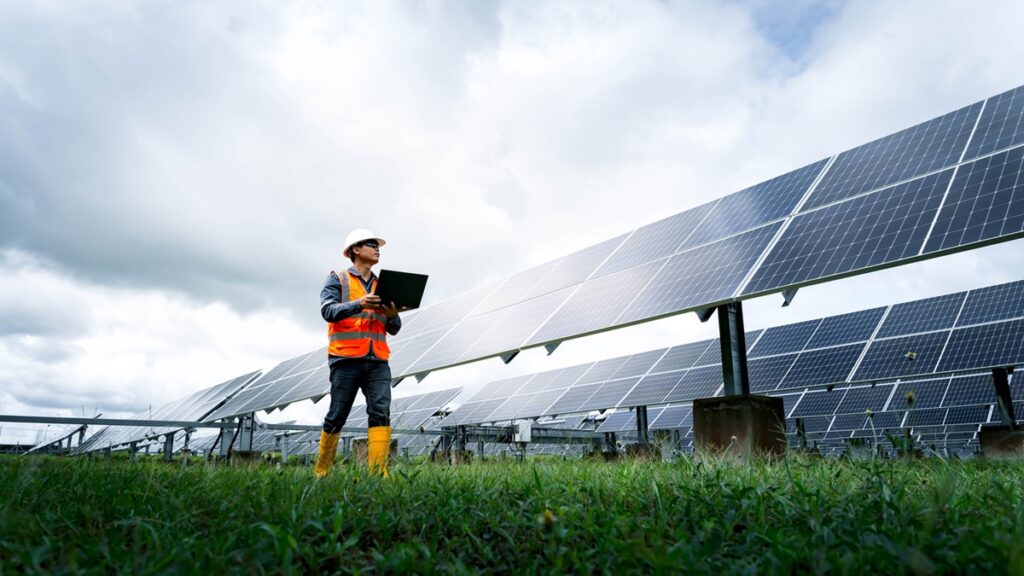 The solar farm(solar panel) with engineers check the operation of the system, Alternative energy to conserve the world's energy, Photovoltaic module idea for clean energy production.